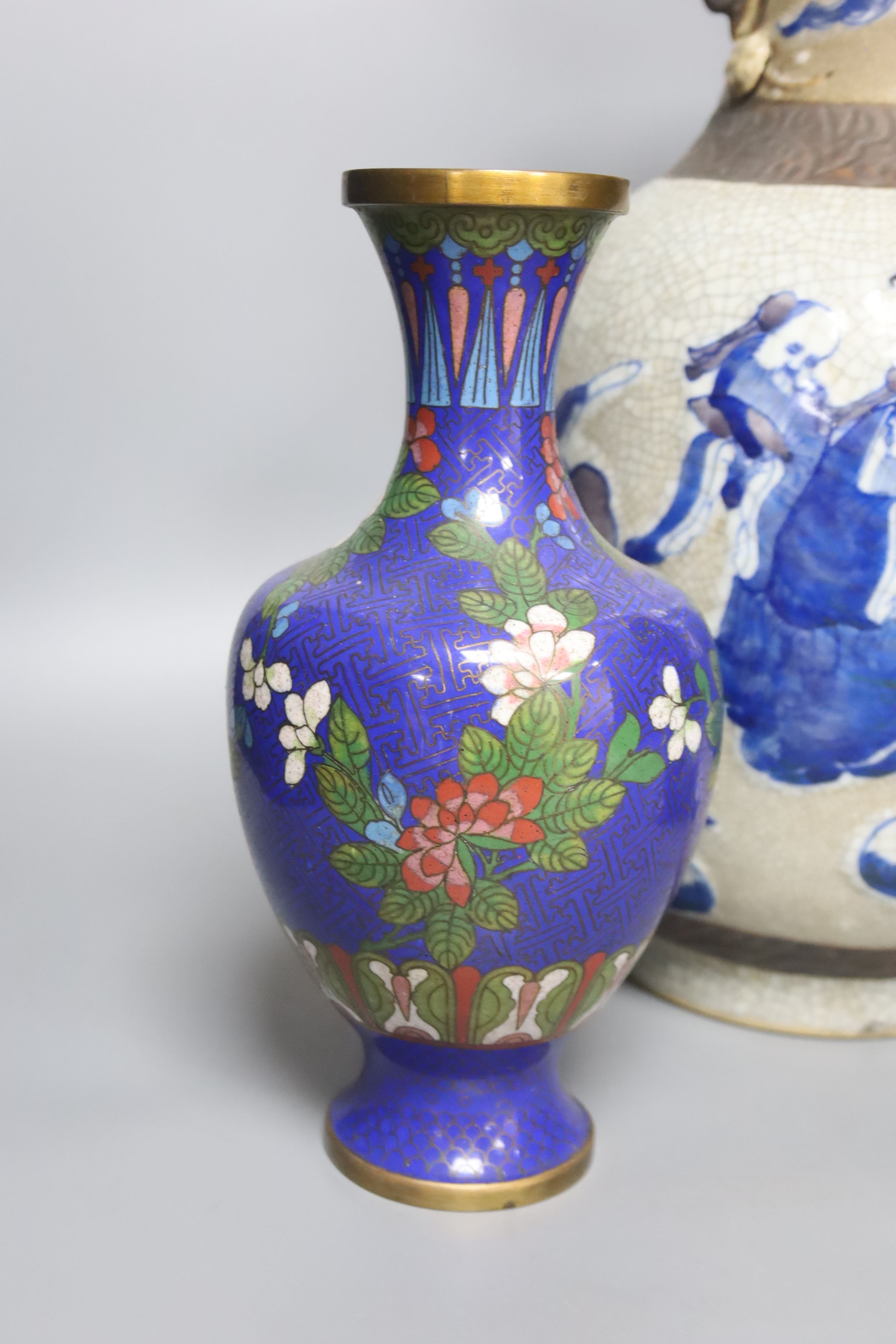 A Chinese blue and white crackle glaze vase, a similar cloisonne vase and a bronze vase, tallest 38cm